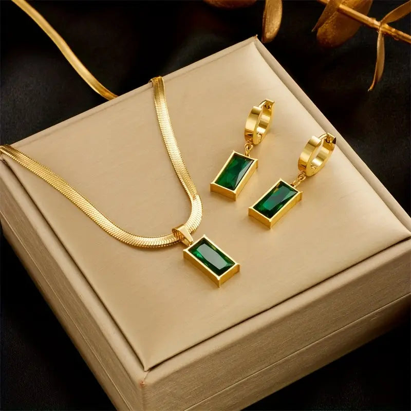 Veda Bremen Iselotte Verdain jewelry set with gold necklace, earrings, and bracelet featuring elegant design and intricate details.