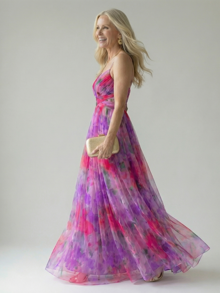 Veda Bremen Isel soft wrap maxi dress in fabric with a flowing silhouette and elegant design, displayed on a hanger.