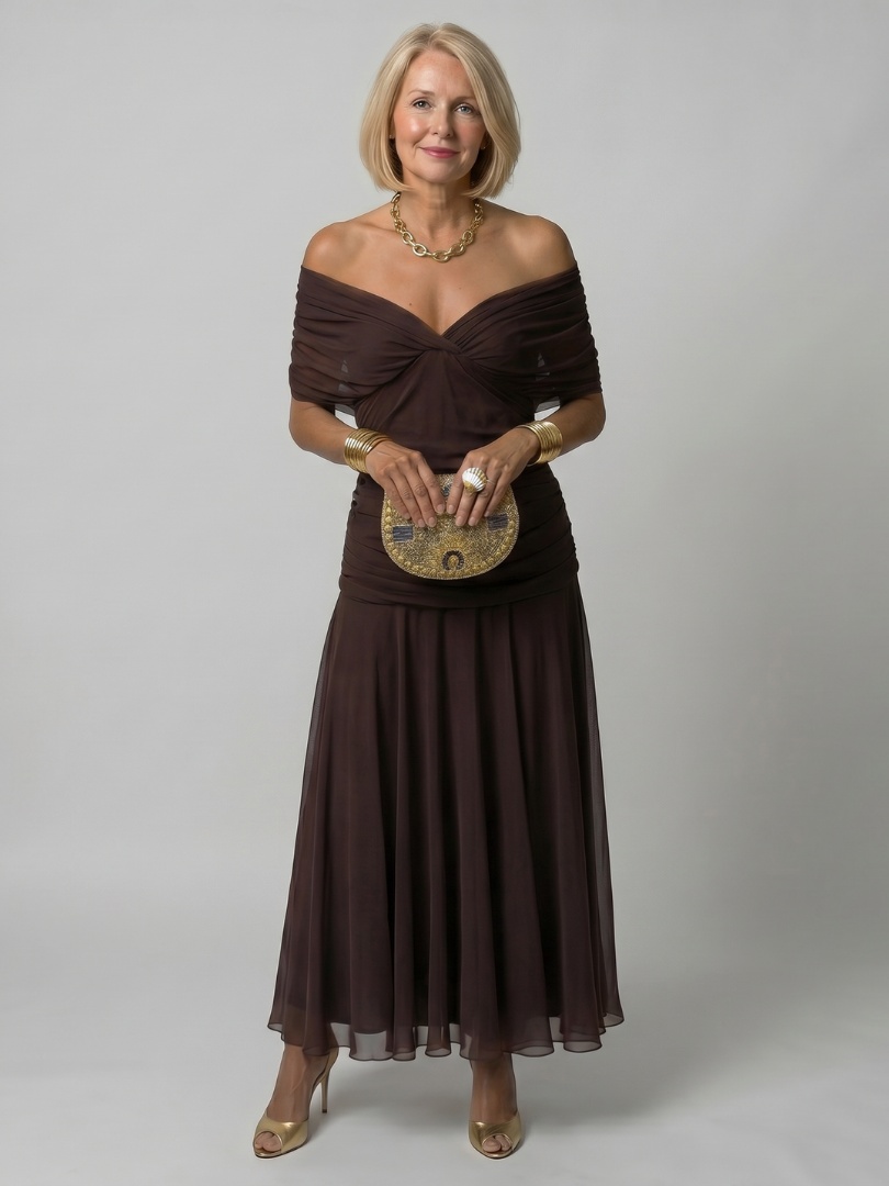 Veda Bremen Calen off-shoulder midi dress with flowing silhouette, featuring a stylish off-shoulder design and elegant drape.