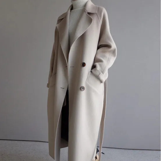 LuroLondon Elara elegant coat in neutral fabric, showcasing a tailored fit with classic collar and button details.