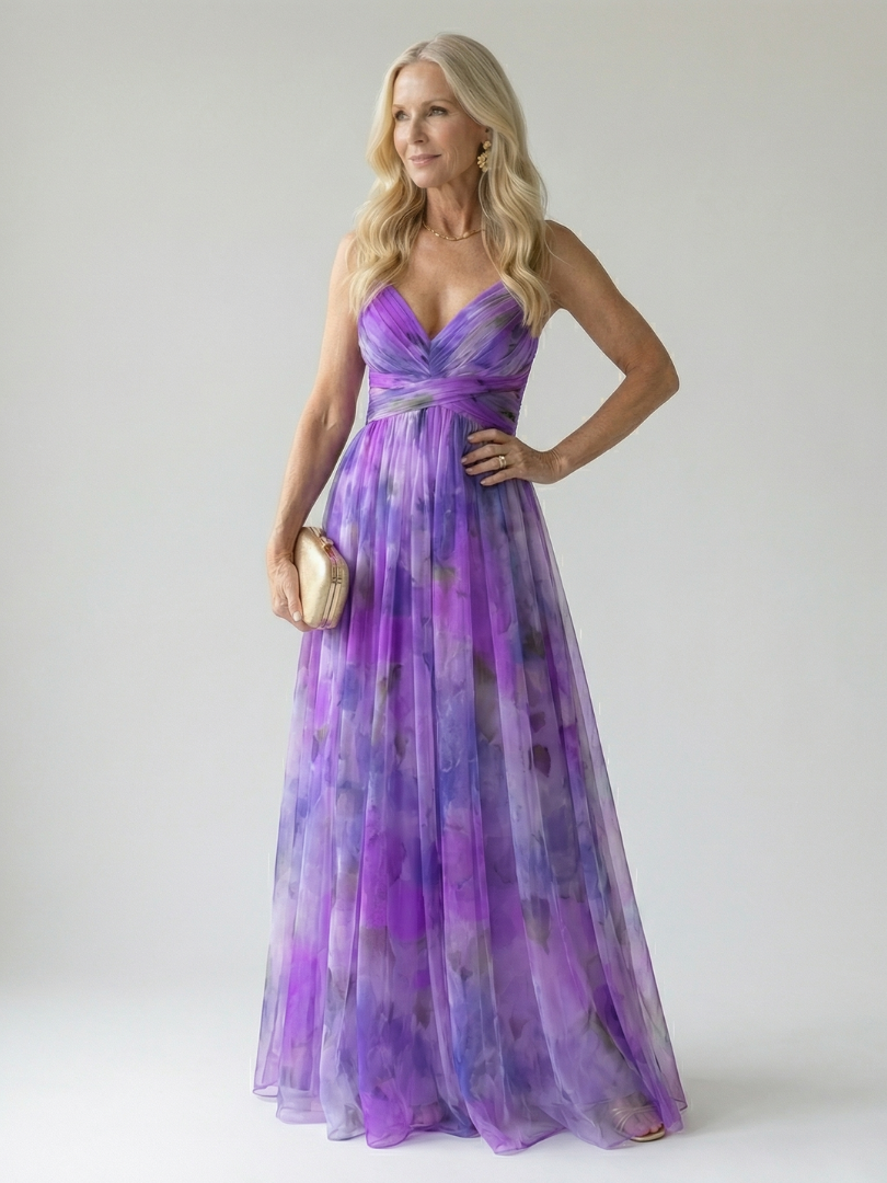 Veda Bremen Isel soft wrap maxi dress in lightweight fabric displayed on a hanger with a flowing silhouette and subtle pattern.