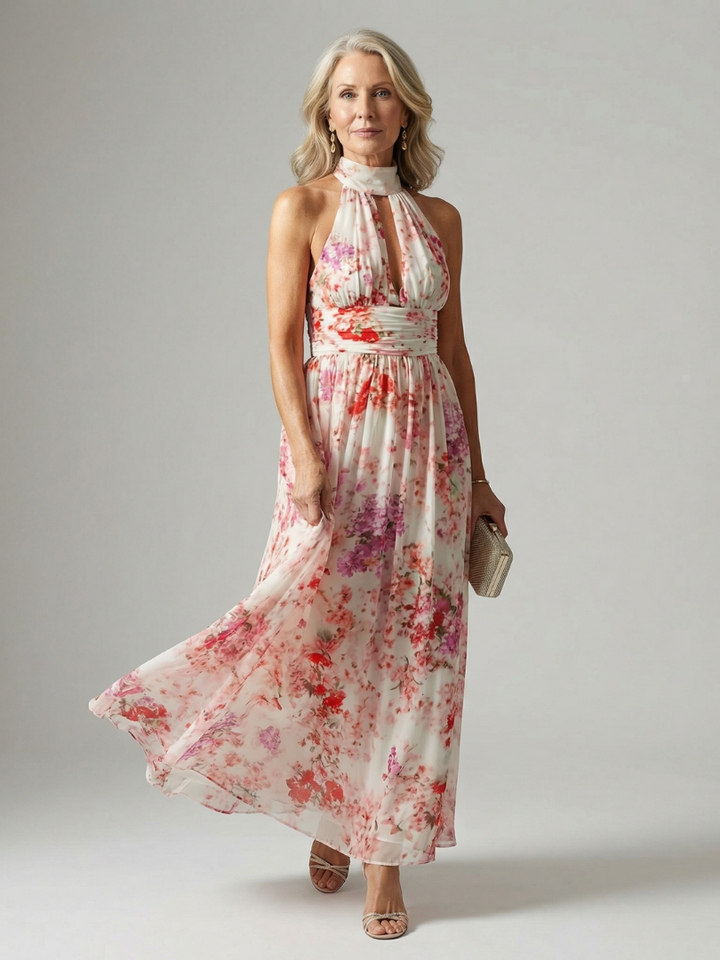 Veda Bremen Elyon flowing maxi dress in lightweight fabric, featuring a relaxed fit and elegant design, displayed hanging on a rack.
