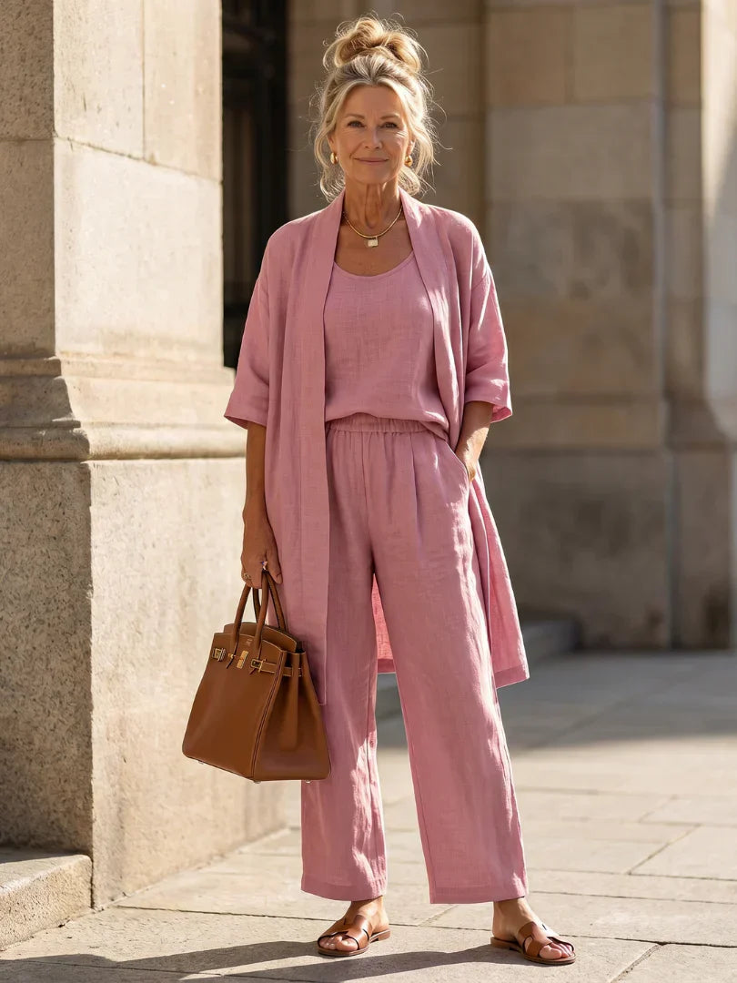 Veda Bremen Linnea lightweight linen set displayed on a hanger, soft beige fabric, casual and elegant summer clothing.