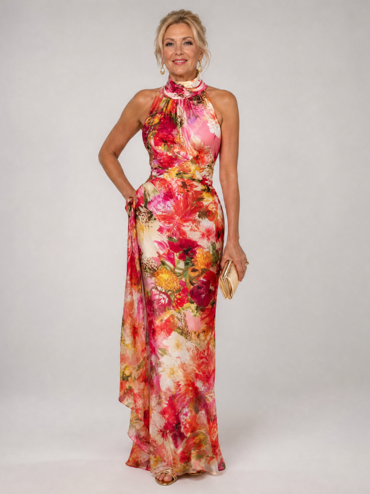 Veda Bremen Elisabetta maxi dress with neckholder and floral print, flowing fabric and vibrant garden-inspired design.