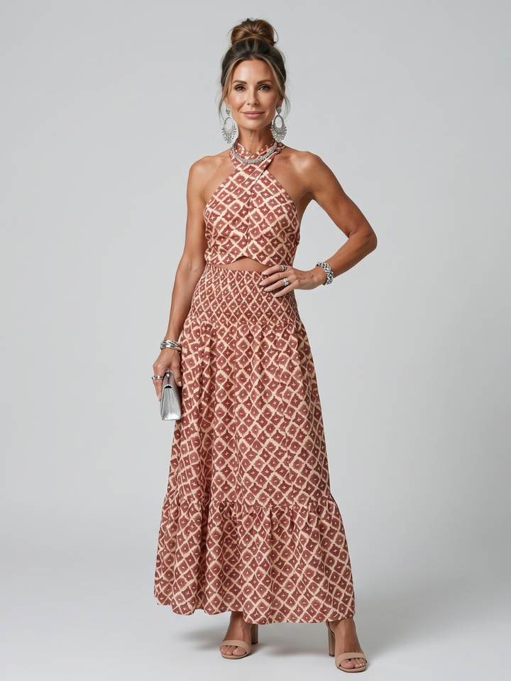 Veda Bremen Amira midikleid with crossed neckholder, geometric print, and cut-out details, shown on a mannequin.