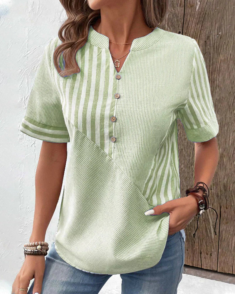 Veda Bremen Talia elegant striped blouse with long sleeves and button-up front, displayed on a hanger.