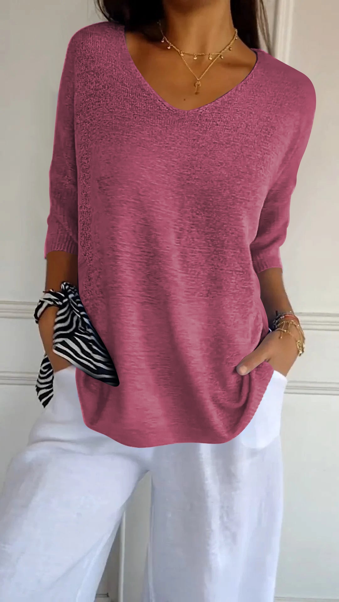 Veda Bremen Jill sleeveless V-neck top in soft fabric, shown on a hanger with a neutral background.