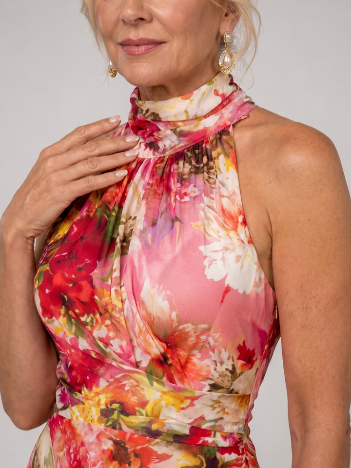 Veda Bremen Elisabetta maxi dress with neckholder and floral print, flowing fabric and vibrant botanical pattern.