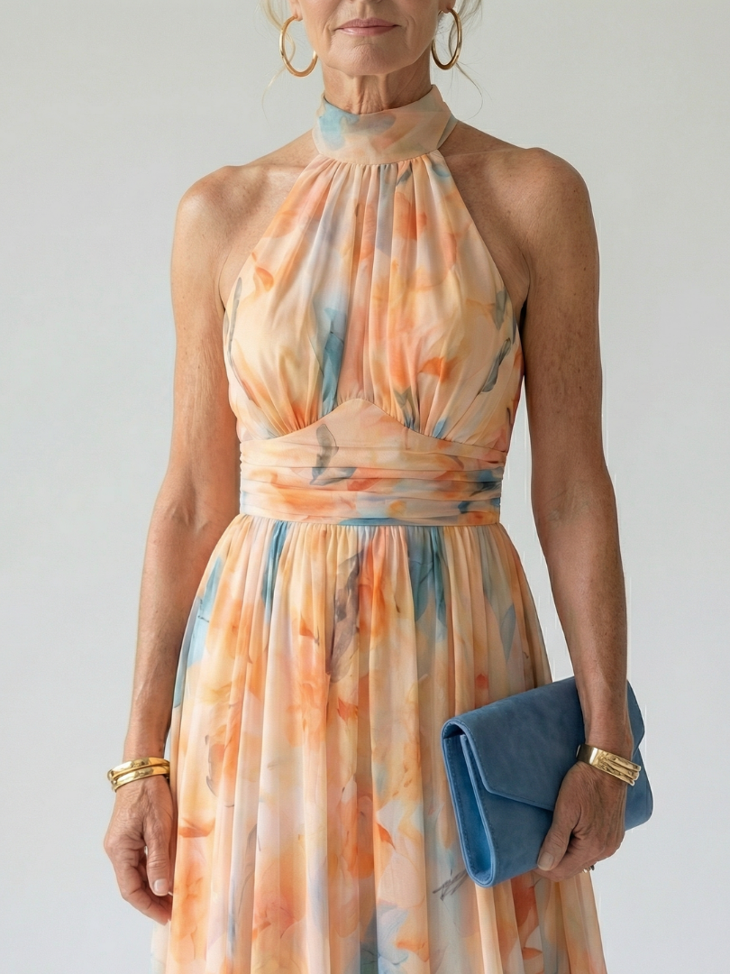 Veda Bremen Elin soft midi dress with neckholder, lightweight fabric, sleeveless design, and elegant fit, shown on a model.