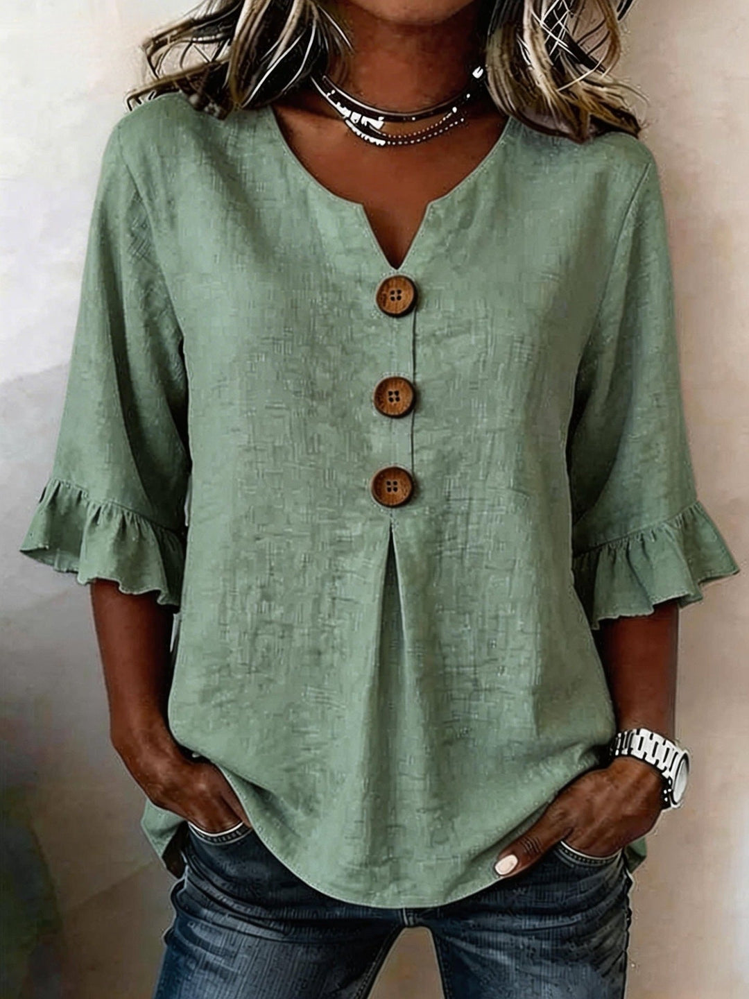Veda Bremen Jessara linen blouse with ruffled sleeves, lightweight fabric, and a relaxed fit for casual and stylish wear.