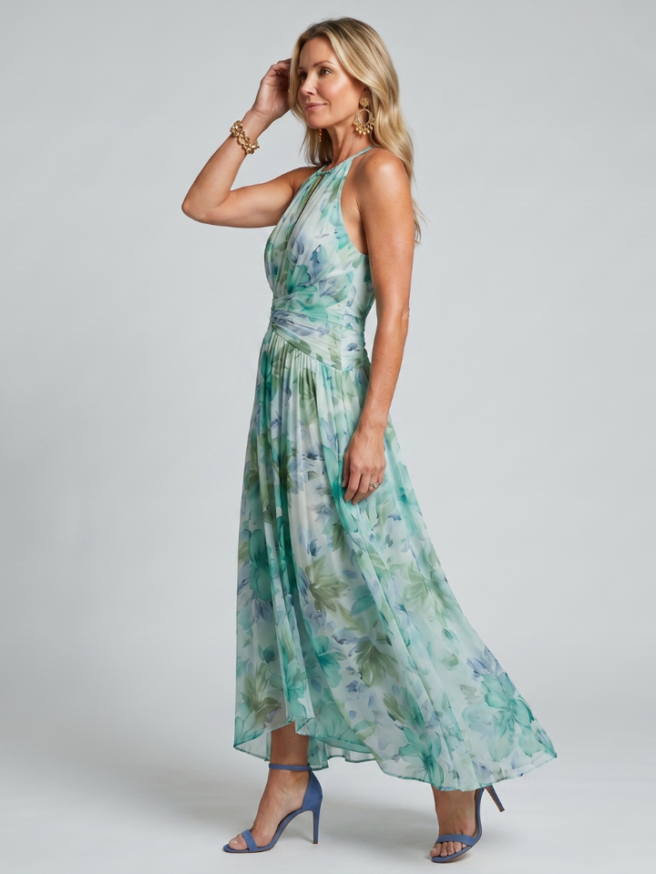 Veda Bremen Portia plissiertes Midikleid with neckholder and delicate floral pattern, showcasing soft pastel colors and flowing fabric.