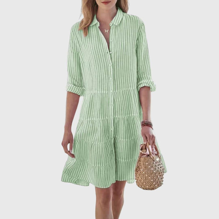 Veda Bremen Lolita lightweight striped dress with flowing fabric, featuring vertical stripes and a relaxed fit, on a hanger.