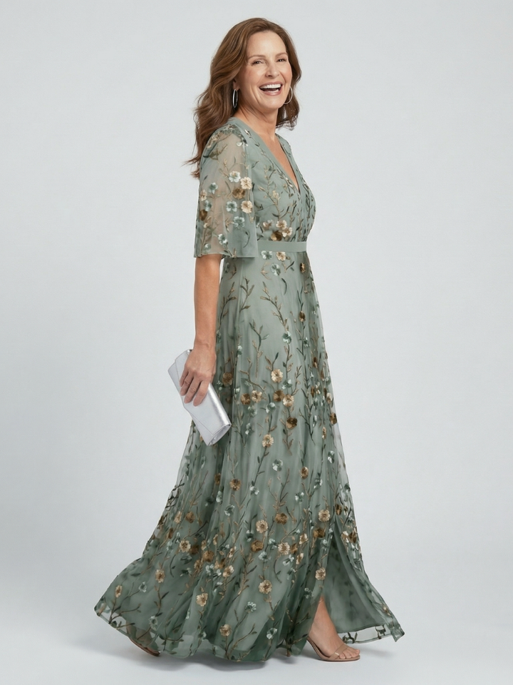 Veda Bremen Selora maxi dress with neckholder and bloom-flow cut, beige flowy summer dress on a hanger.