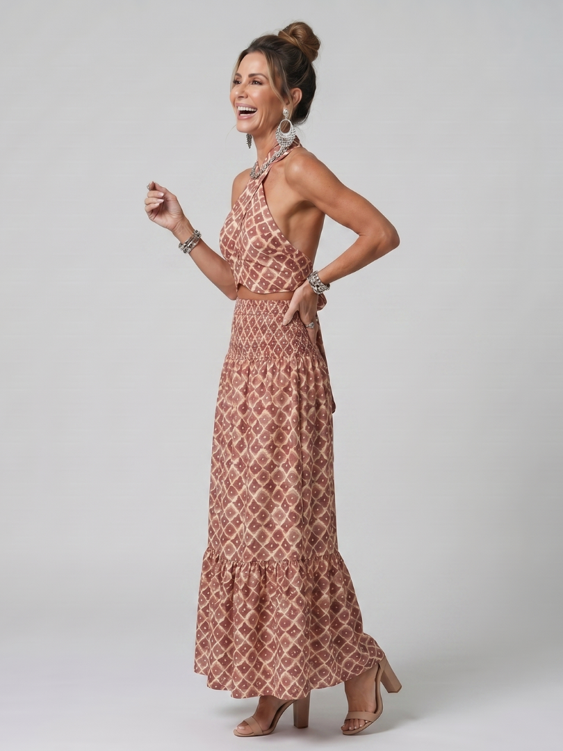 Veda Bremen Amira midikleid with crisscross neckholder, geometric print, and cut-out detail, shown on a model.