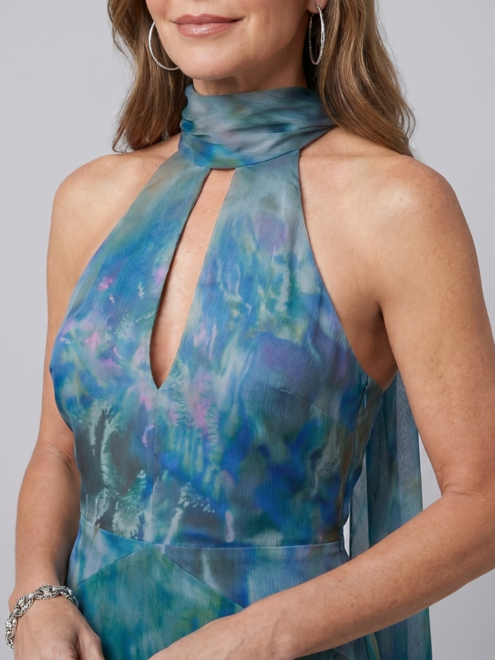 Veda Bremen Juniper sleeveless maxi dress with neckholder and cut-out details, shown in a stylish, flowing design.
