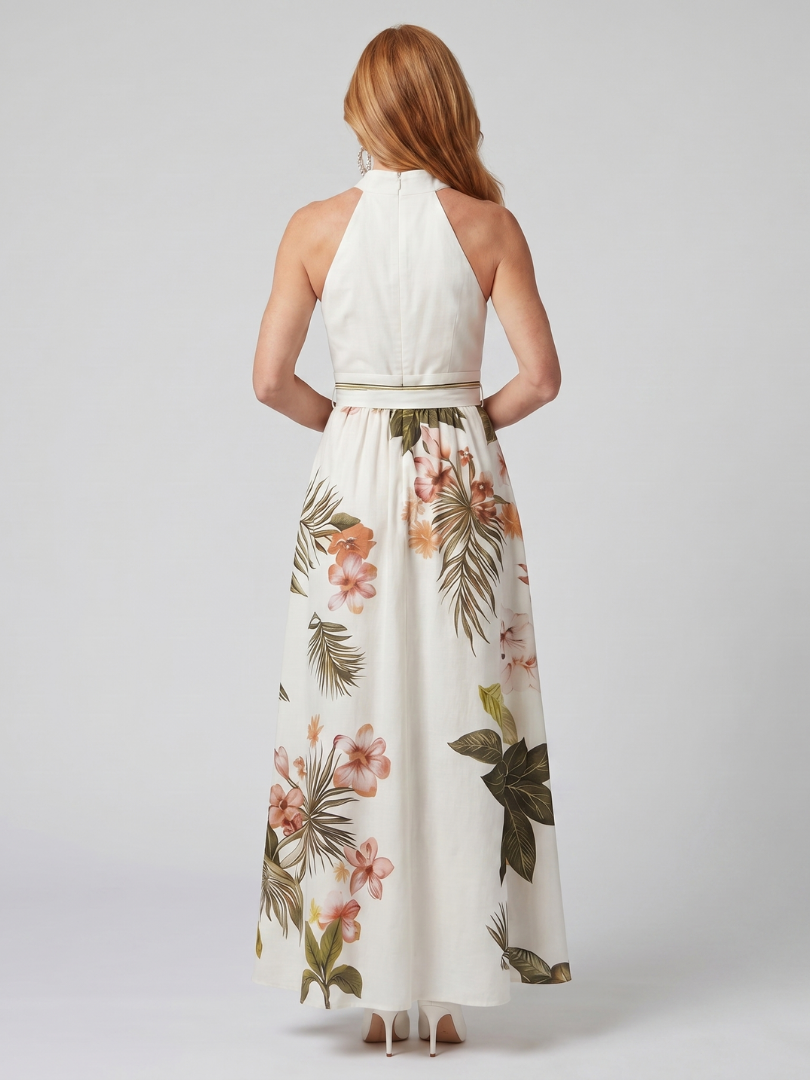 Veda Bremen Meadow maxi dress with neckholder, draping, and botanical details, shown on a model.