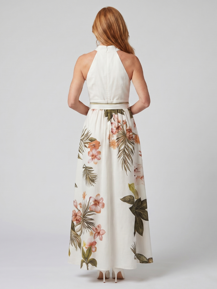 Veda Bremen Meadow maxi dress with neckholder, draping, and botanical details, shown on a model.