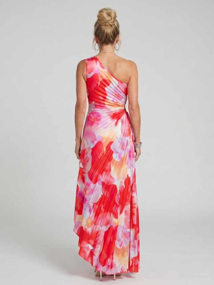Veda Bremen Taya midi dress with one-shoulder strap and pleated bodice, shown on a model.