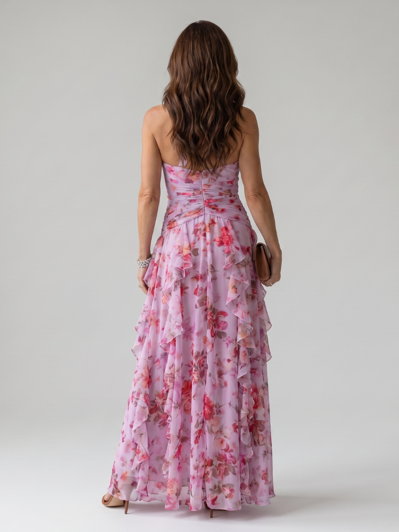 Veda Bremen Nori maxi dress with neckholder, gathered top, and floral print, shown on a hanger against a neutral background.