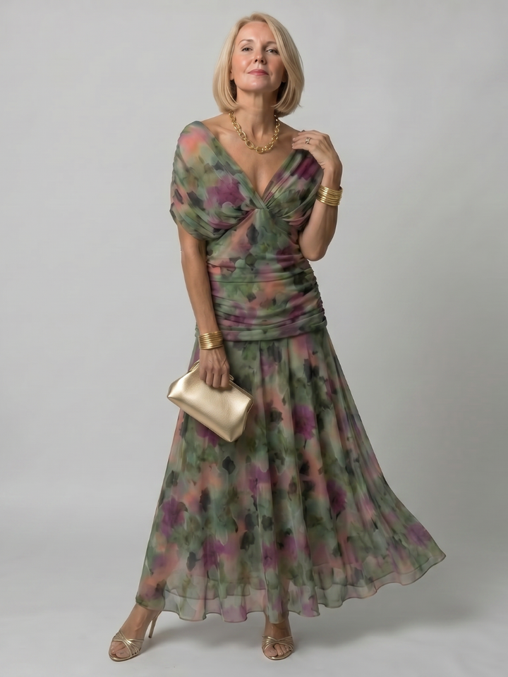 Veda Bremen Calen off-shoulder midi dress with flowing fabric, featuring a relaxed fit and elegant design.