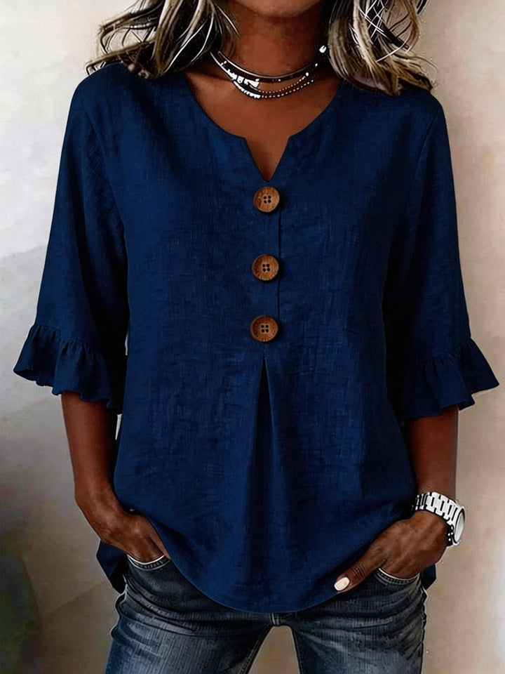 Veda Bremen Jessara linen blouse with ruffled sleeves, lightweight fabric, and a relaxed fit, shown in a natural, casual style.
