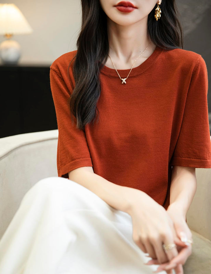 Veda Bremen 100% Merino Wool crew neck tee shirt, soft and cozy, displayed on a hanger against a neutral background.