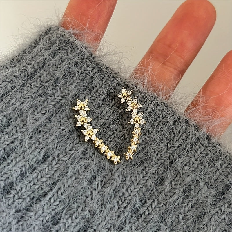 Veda Bremen timeless flower earrings featuring delicate floral design and silver hooks, perfect for elegant jewelry styling.