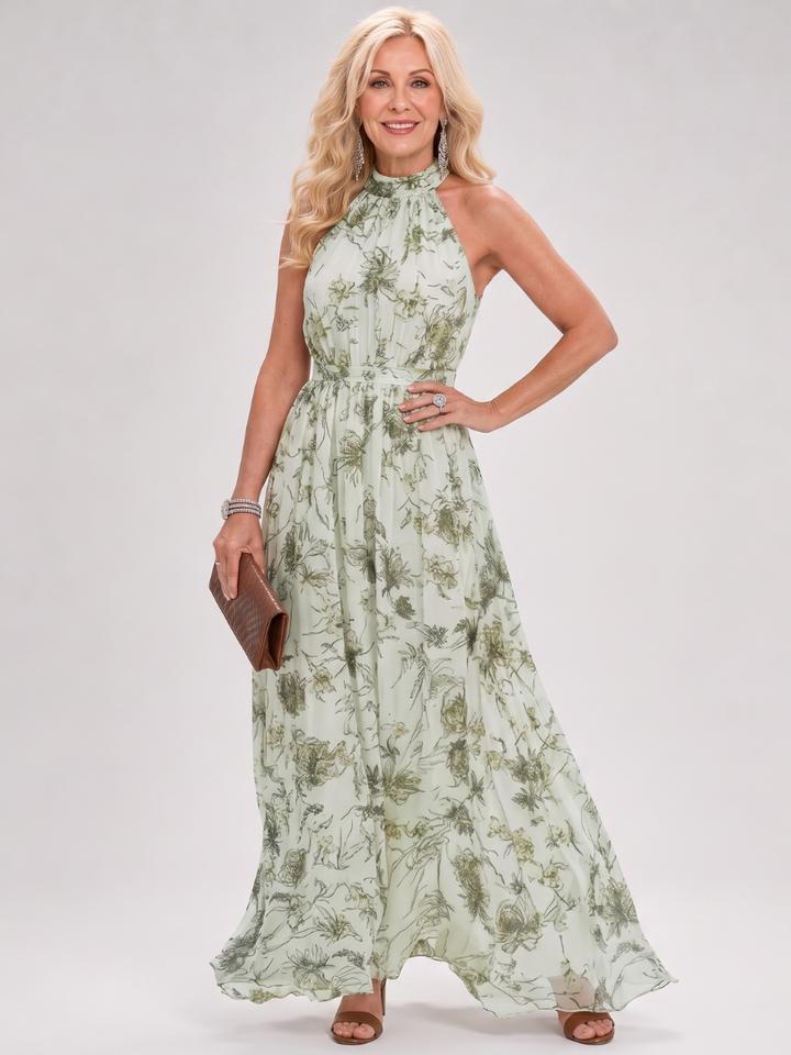 Veda Bremen Guinevere midikleid with floral print, flowing skirt and elegant design, shown on a model.
