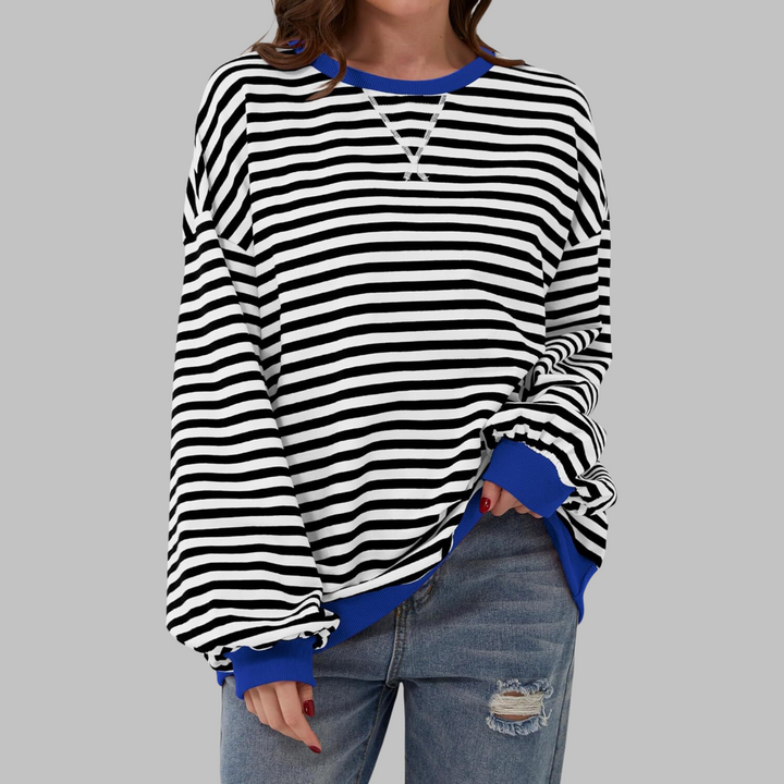 Veda Bremen LUKA soft striped long-sleeve top, lightweight spring layer, casual fitted shirt with subtle pastel stripes displayed on hanger.