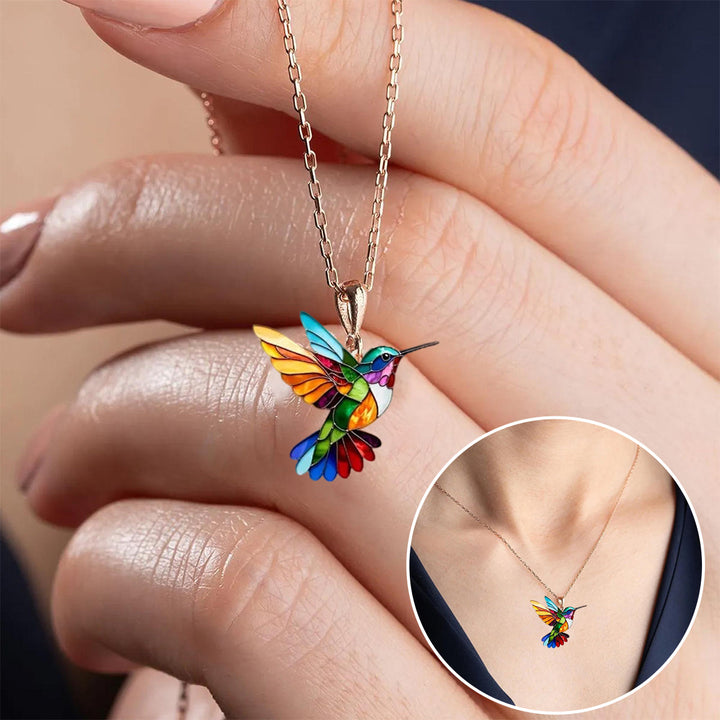 Veda Bremen beautiful hummingbird necklace with matching earrings, showcasing delicate jewelry design in gold-tone metal.