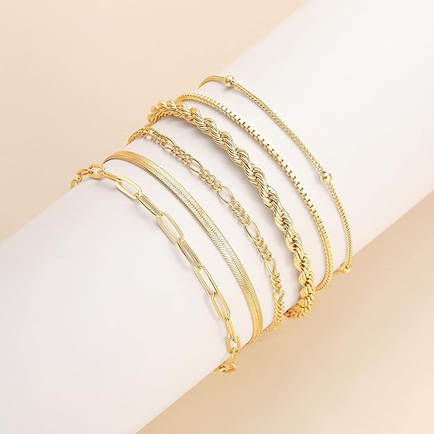 Veda Bremen Isabella Vernetta gold bracelet set featuring multiple delicate gold bangles on a white background