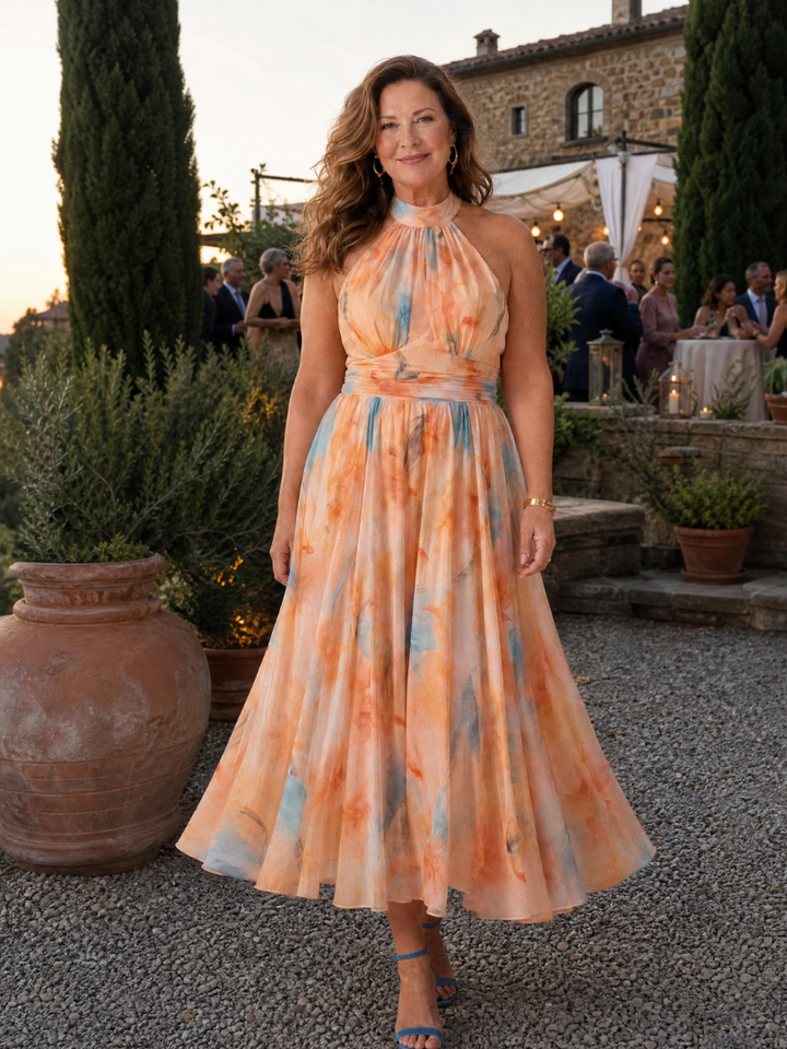 Veda Bremen Elin soft midi dress with neckholder and flowy fabric, showcased on a model in a stylish, elegant pose.
