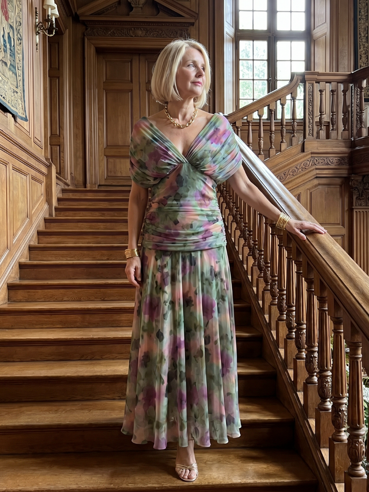 Veda Bremen Calen off-shoulder midi dress with flowing fabric, showcasing a stylish off-shoulder neckline and elegant silhouette.