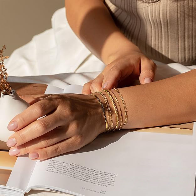 Veda Bremen Isabella Vernetta bracelet set in gold, featuring multiple dainty and stylish bracelets on a white background.