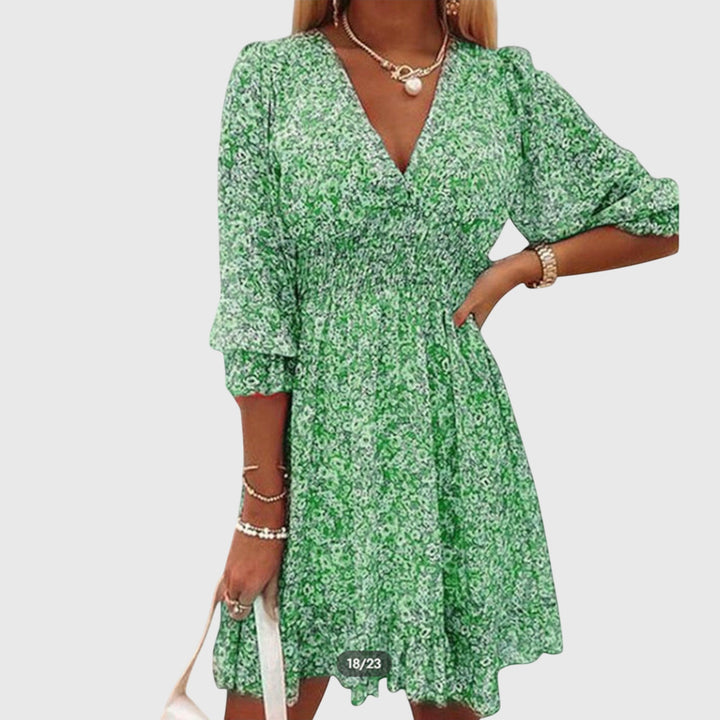 Veda Bremen Elisa floral puff sleeve dress with a ruffled neckline and lightweight fabric, styled for a feminine look.