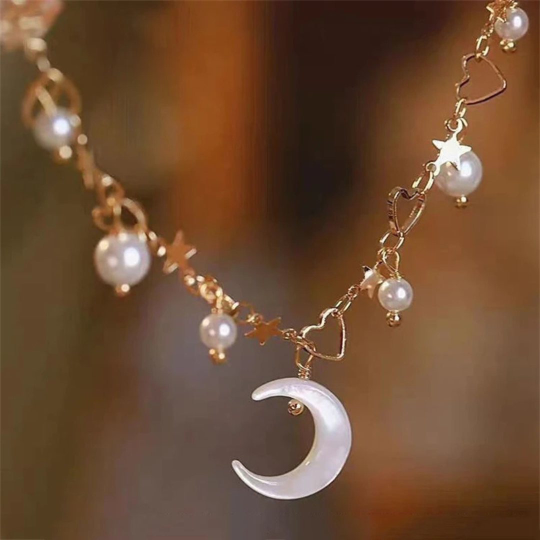 Veda Bremen Celeste charm bracelet featuring delicate silver charms on a sleek chain.