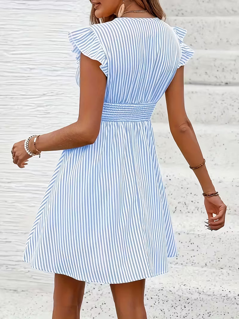 Veda Bremen ruffled striped dress featuring a feminine, flowing silhouette and colorful horizontal stripe pattern.