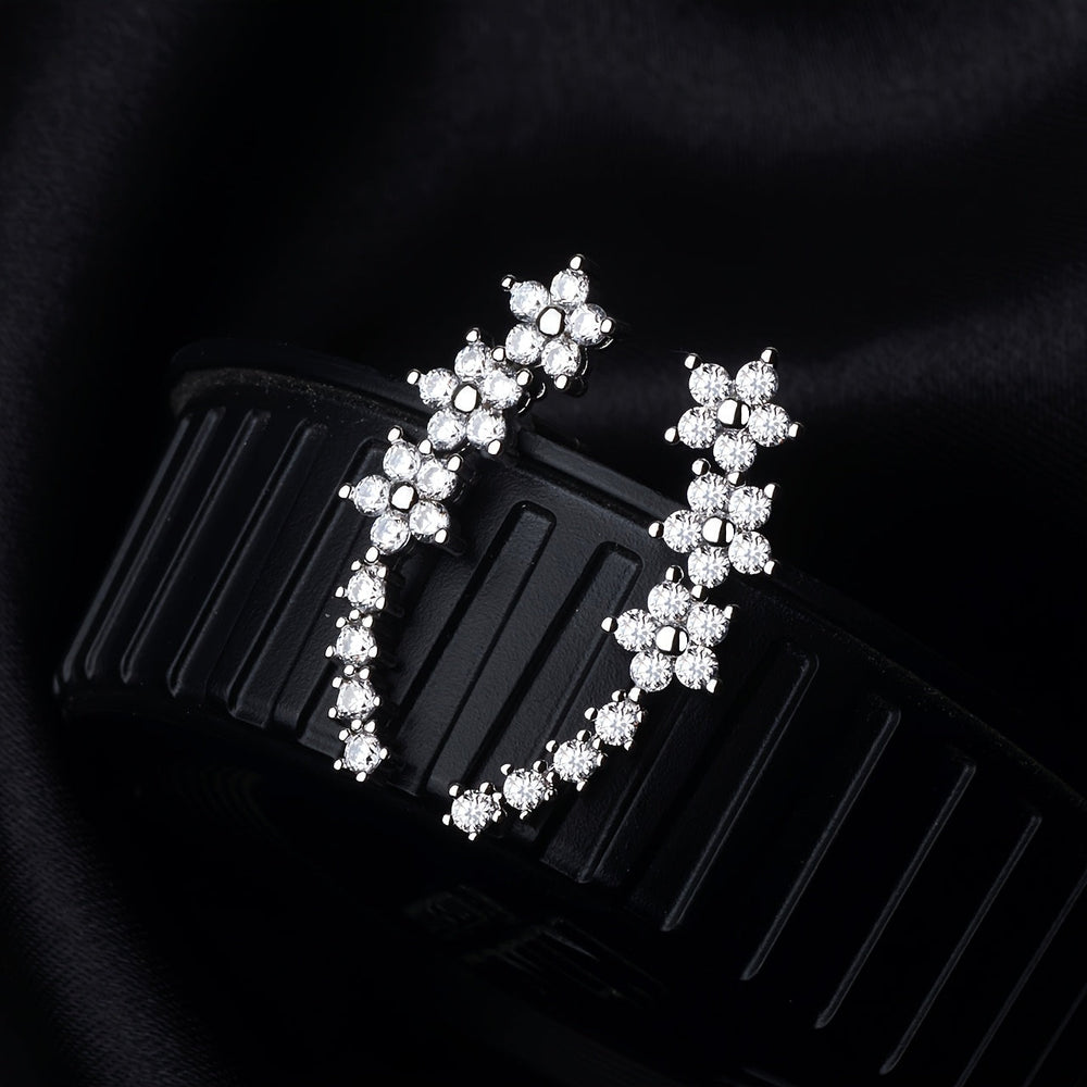 Veda Bremen timeless flower earrings featuring delicate floral design in silver with intricate detailing on a plain background