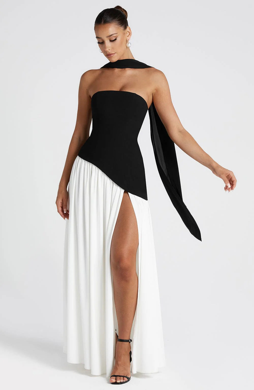 Black and white image of THE AYVA MAXI DRESS by Lurolondon, showcasing its elegant, flowing design and stylish length.