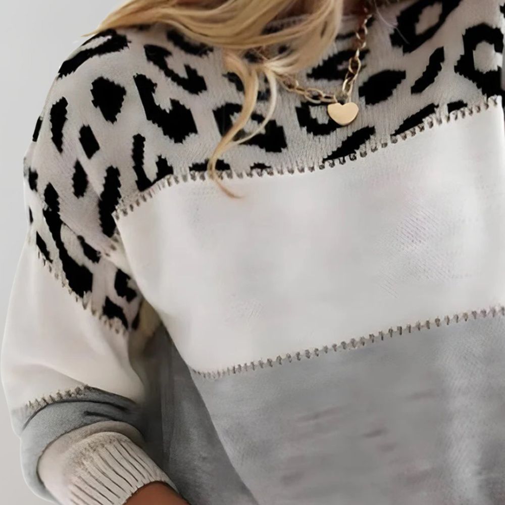 LuroLondon Vanita leopard sweater in gray featuring a cozy knit with leopard print pattern, displayed on a hanger.
