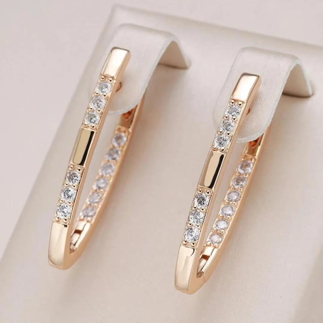 Veda Bremen elegant earrings with sparkling zirconia stones, showcasing intricate design and shiny gemstones.