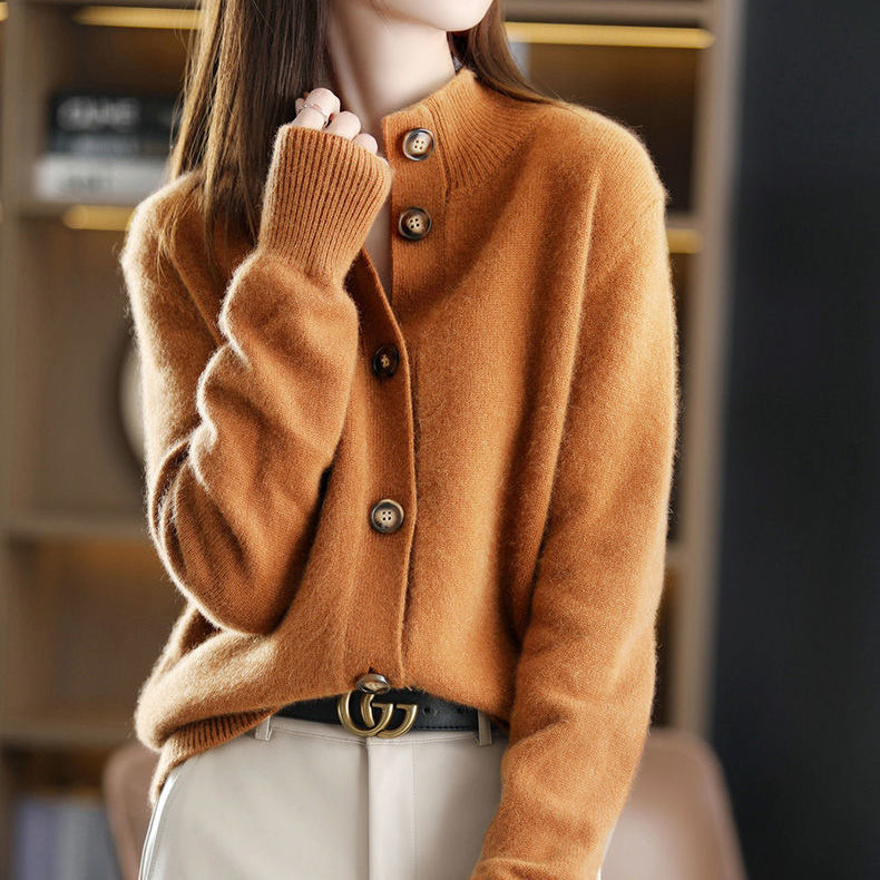 A caramel-colored Luxe Cashmere Cardigan by Ava Mae featuring a soft, cozy knit fabric and a relaxed fit.