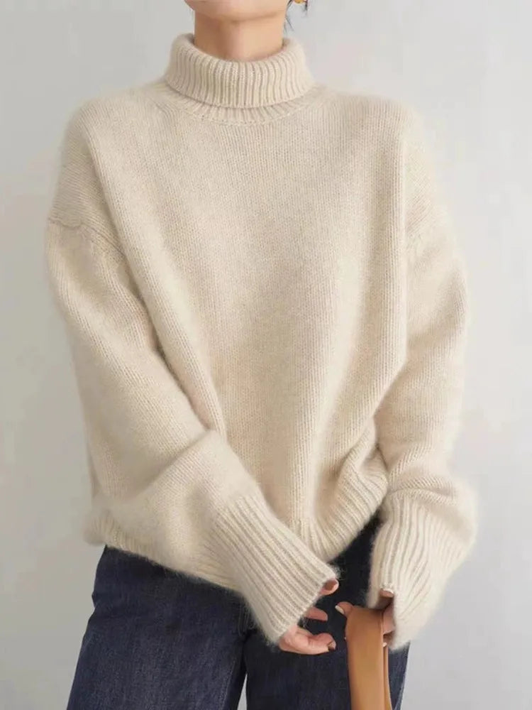 LuroLondon Marilou Cashmere Turtleneck sweater in warm beige with a cozy fit, perfect for fall and winter wear.