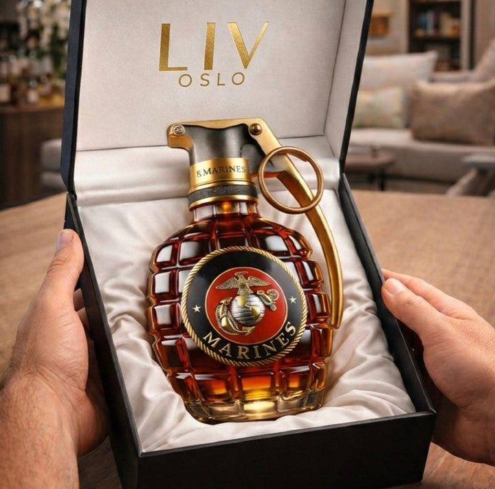 Veda Bremen Pomegranate Edition whisky bottle with vibrant pomegranate-themed label and clear glass showcasing the golden liquid inside.