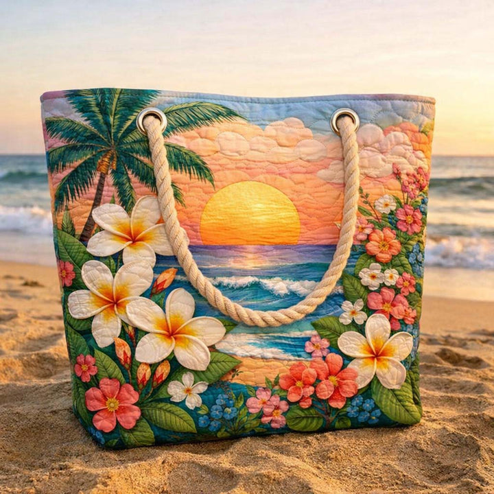Quilted tropical vibe beach bag by Veda Bremen with woven handle, featuring vibrant tropical print and spacious design.