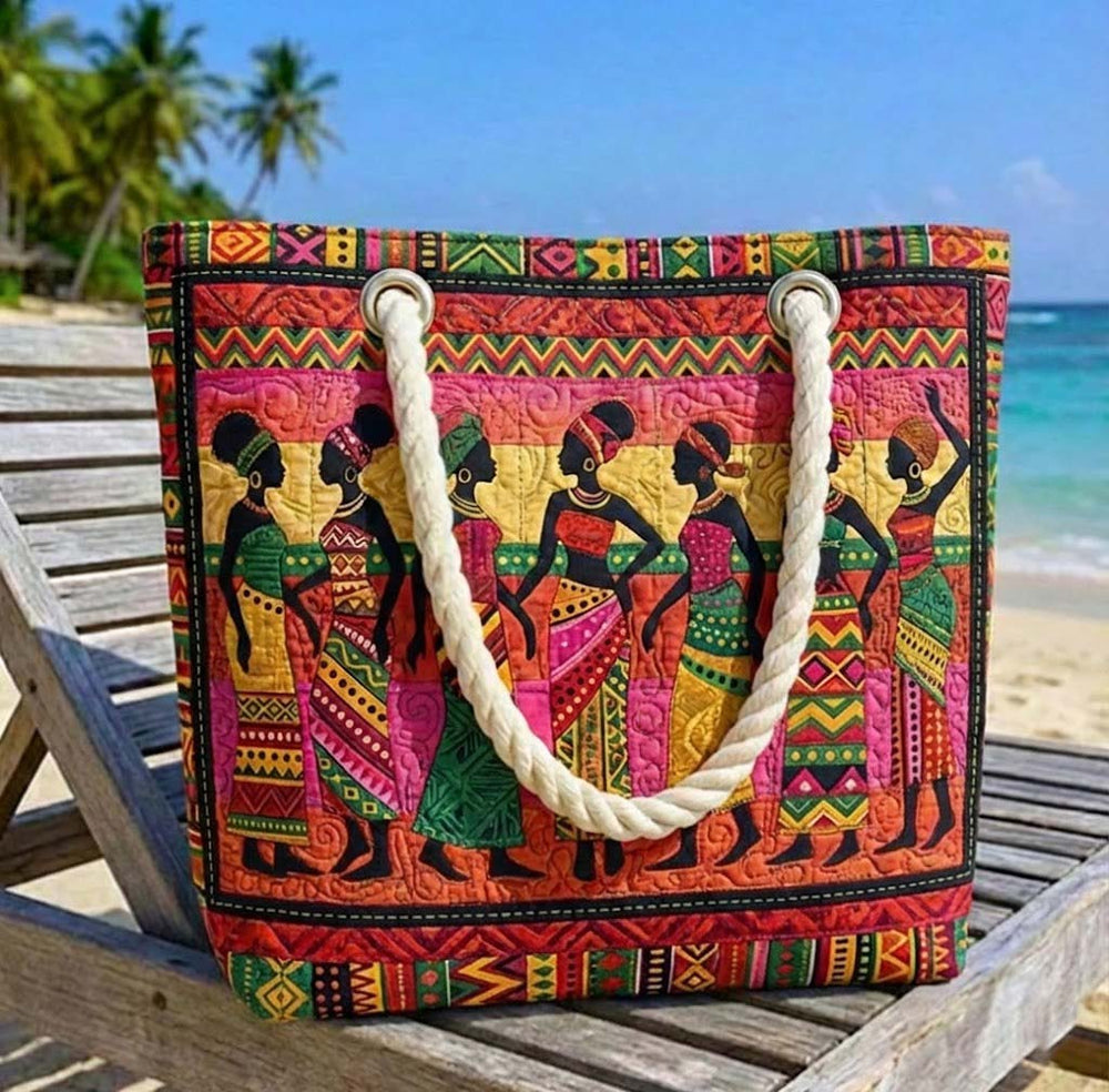 Veda Bremen Melanin Queens quilted beach bag with woven handles and spacious interior for carrying beach essentials.