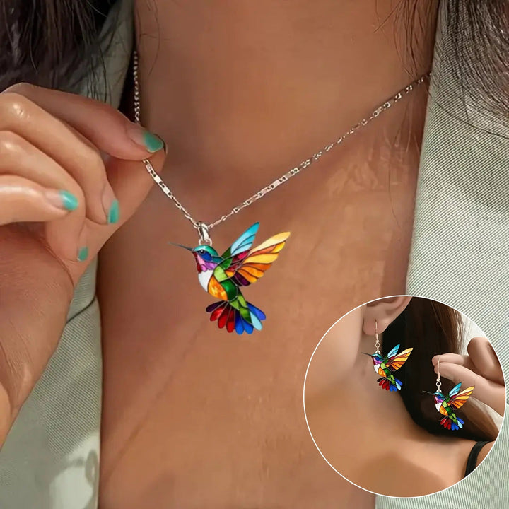 Veda Bremen delicate hummingbird necklace with matching earrings, featuring intricate design and elegant gold finish.