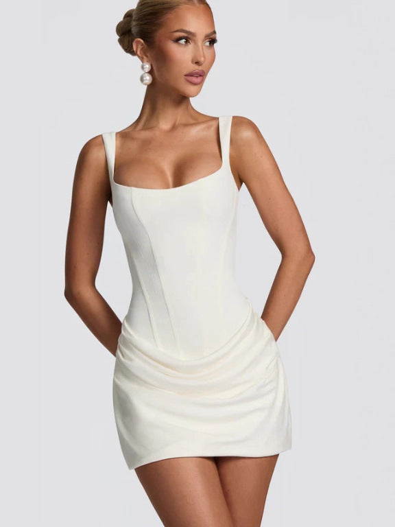 White Isla mini dress by Lurolondon.co.uk featuring a stylish, fitted silhouette and short sleeves, perfect for casual or dressy occasions.