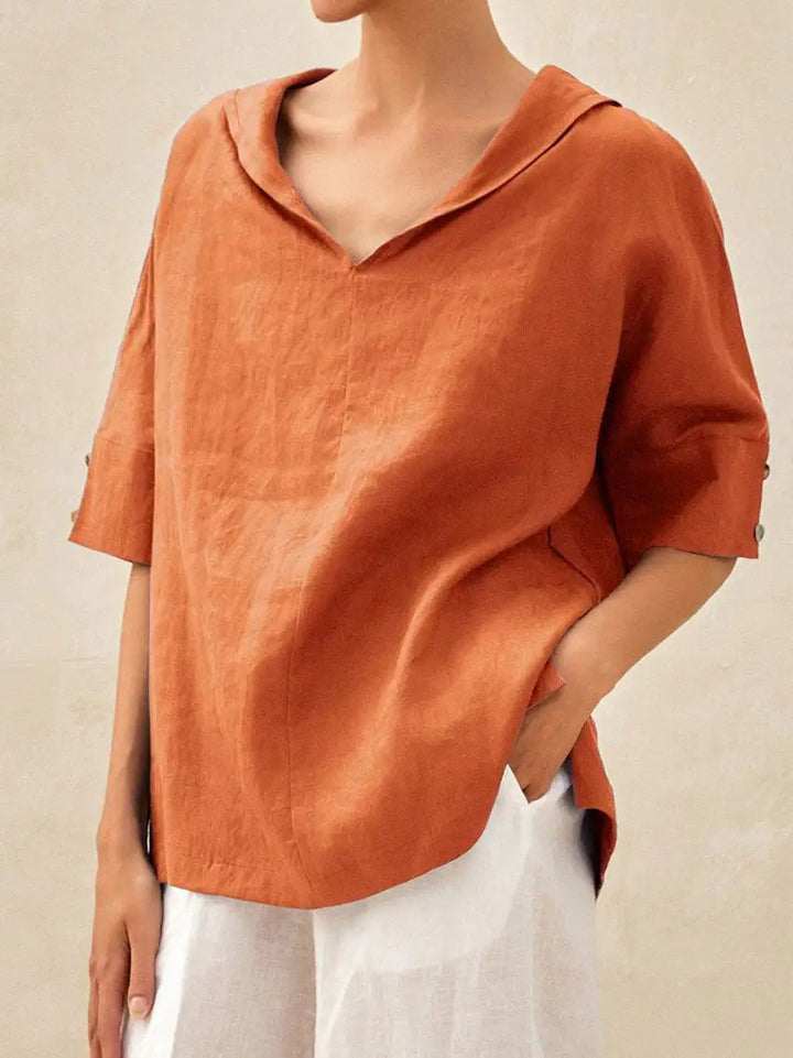 Light beige Veda Bremen linen blouse with V-neck and classic fit, shown on a mannequin.