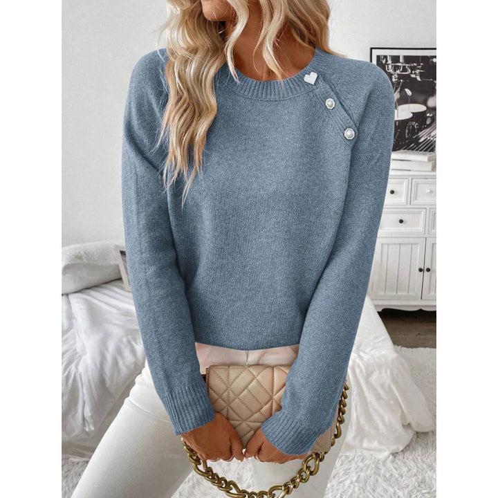 LuroLondon button-decorated sweater featuring a cozy knit with stylish button details in a close-up view.